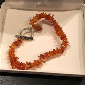 Amber bracelet that says imagine